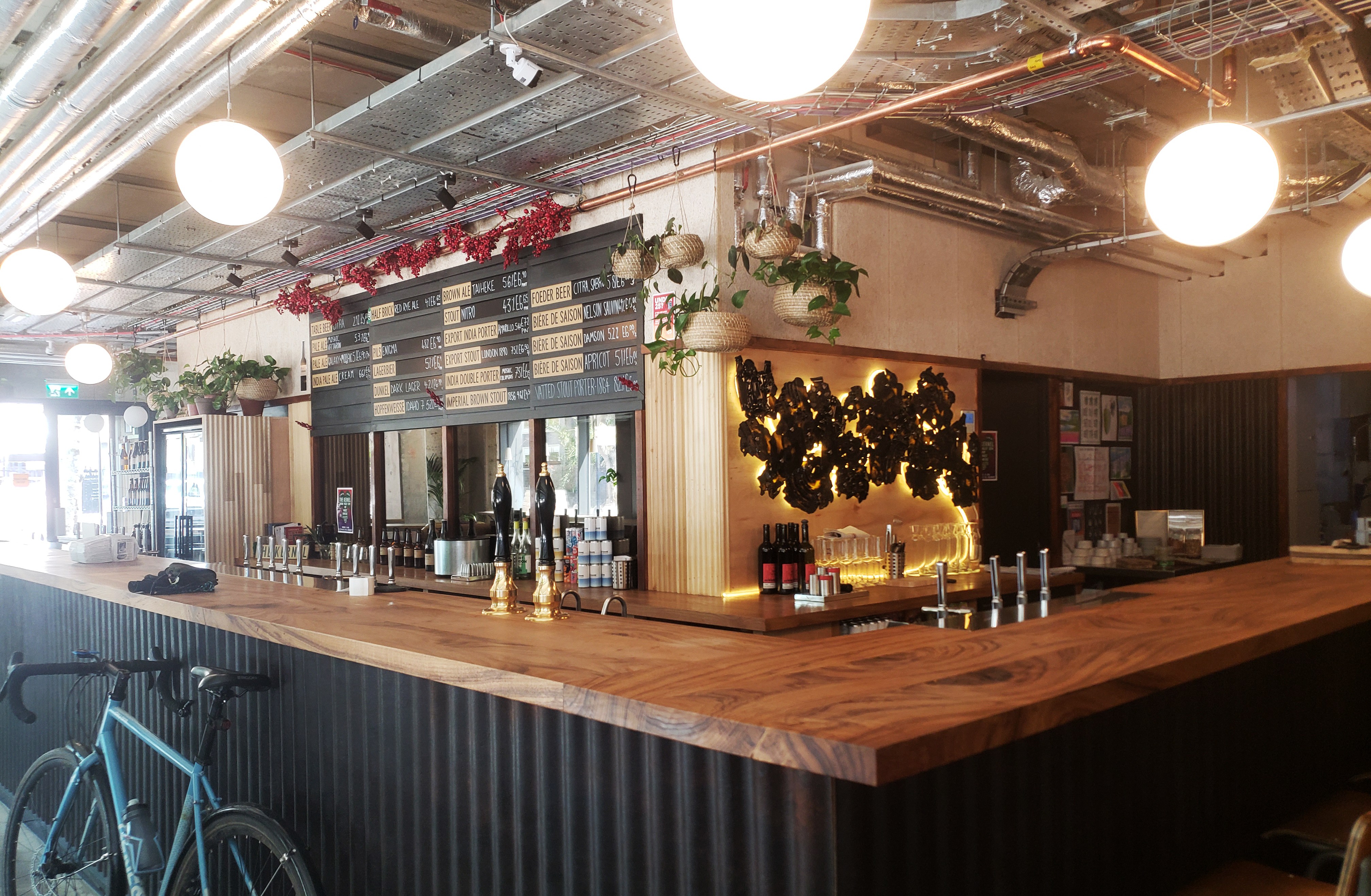 Inside the Kernel taproom showcasing taps and menu.